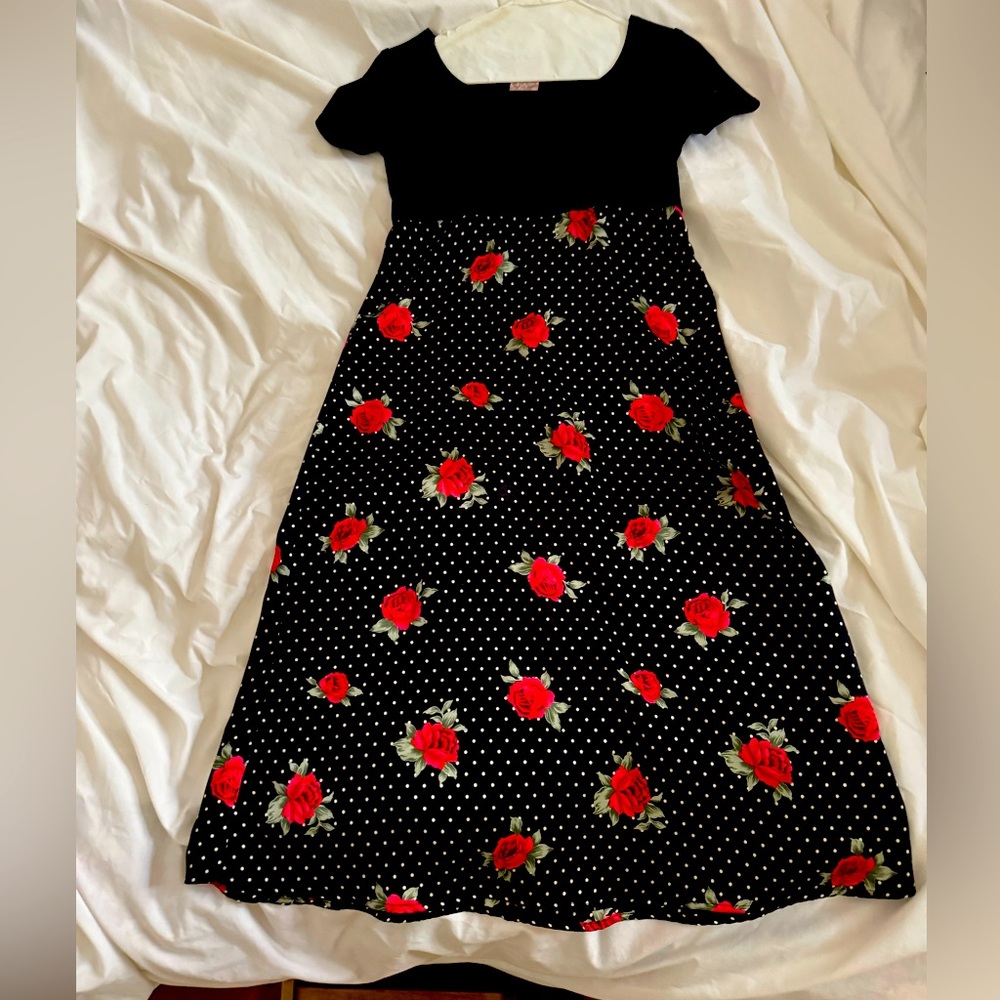 Girls party dress.  Black velvet top with satin rose print skirt. Size 10